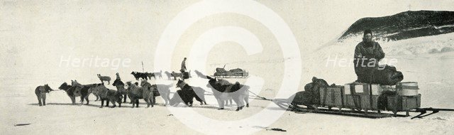 'Meares and Demetri with Their Dog Teams Leaving Hut Point', c1911, (1913). Artist: Herbert Ponting.