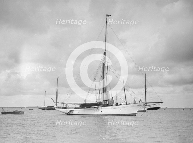 The cutter 'Yolande' at anchor, 1912. Creator: Kirk & Sons of Cowes.