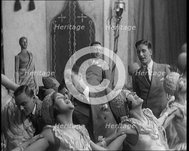 Scene from a Stage Show: Male and Female Civilians Dancing on a Stage in a Routine with..., 1929. Creator: British Pathe Ltd.