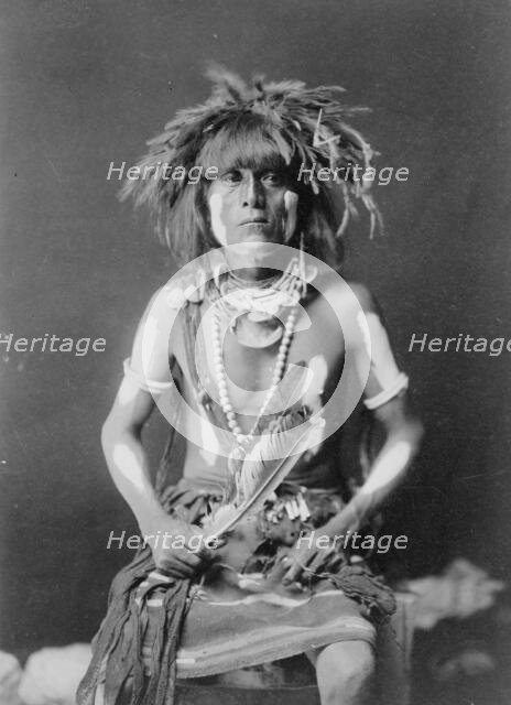 Honovi-Walpi snake priest, with Totkya Day painting, c1910. Creator: Edward Sheriff Curtis.
