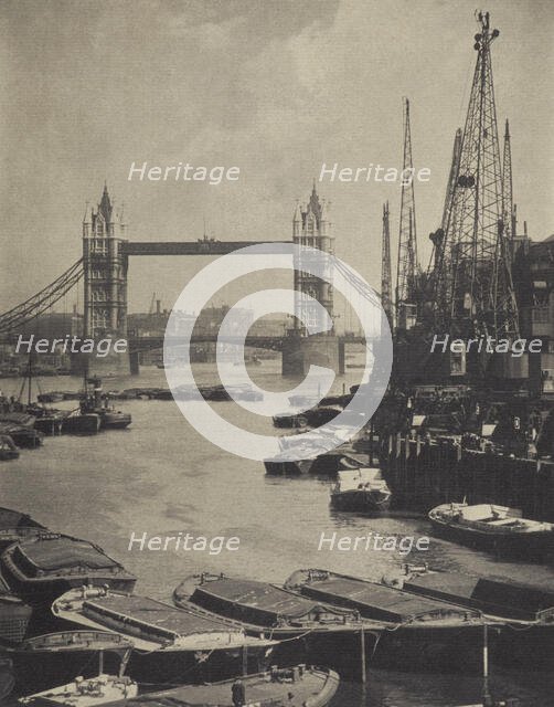 The pool and Tower Bridge. From the album: Photograph album - London, 1920s. Creator: Harry Moult.