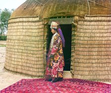 Full-length profile portrait of a woman, possibly Turkman or Kirgiz, standing..., between 1905-1915. Creator: Sergey Mikhaylovich Prokudin-Gorsky.