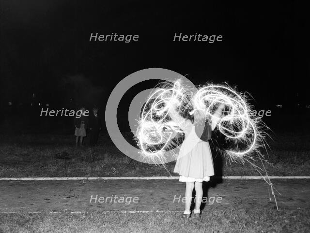 Children with fireworks, c1955. Creator: Arthur Charles Kirby Ware.