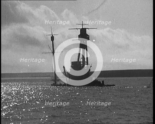 The Hulls of German Warships Scuttled in Scapa Flow Rising from the Waves, 1929. Creator: British Pathe Ltd.
