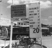 Gas station price analysis, Santa Fe, New Mexico, 1938. Creator: Dorothea Lange.