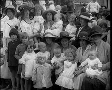 British Mothers Sitting With Their Babies on Their Laps at a Baby Show, 1920. Creator: British Pathe Ltd.