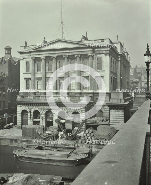 Barges and goods in front of Fishmongers Hall, seen from London Bridge, 1912. Artist: Unknown.