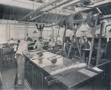 'Final Operations in the Foundry. Trimming the Plates and Finishing', 1917. Artist: Unknown.