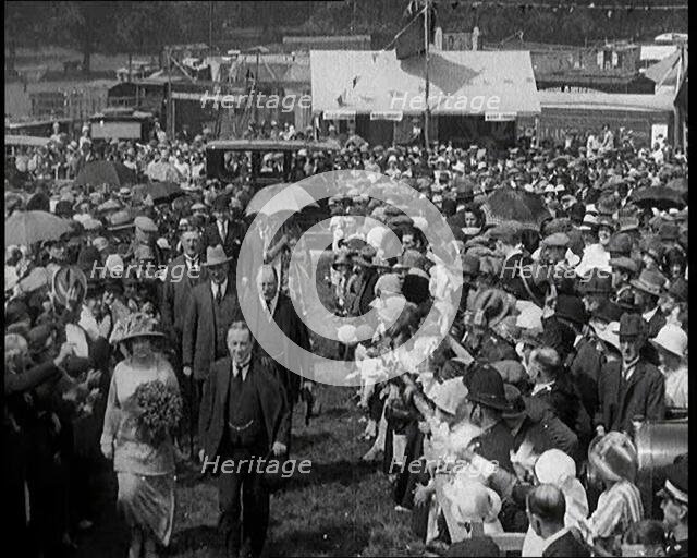 A Group of Politicians Walking Through a Large Crowd of People, 1920s. Creator: British Pathe Ltd.