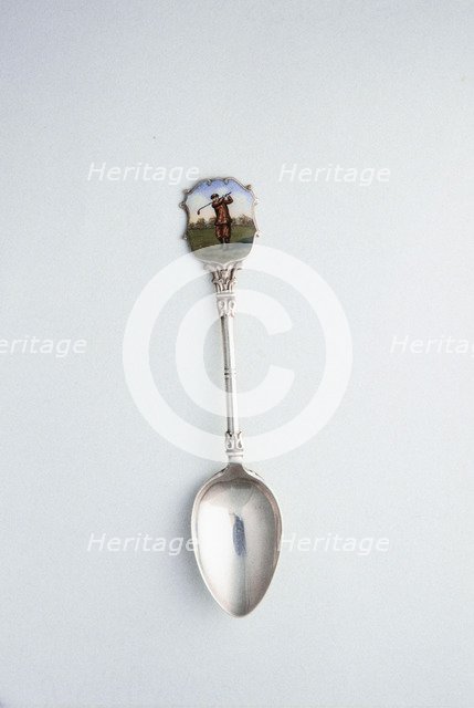 Silver spoon with enamelled shield with golfing theme, London, 1918. Artist: Unknown