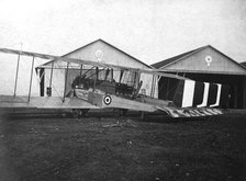England. Caproni 600 biplane H 1918 next to the hangars.