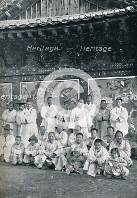 Priests and monks in a Korean monastery, or lamasery, 1902. Artist: Walter Hillier.