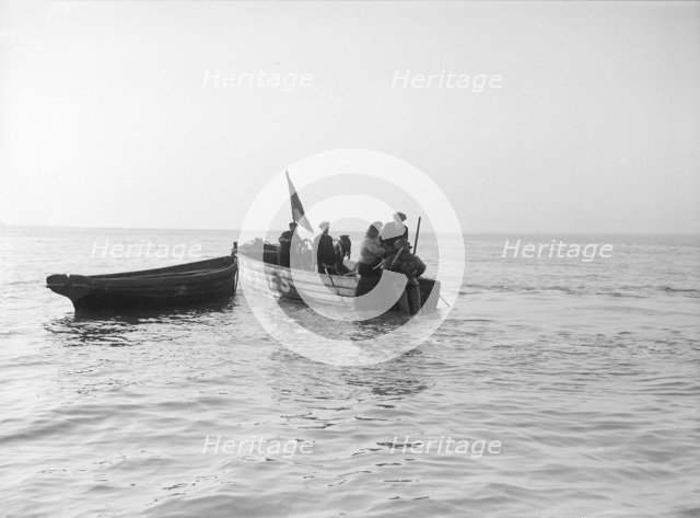 Preparing diver for sea salvage, 1912. Creator: Kirk & Sons of Cowes.