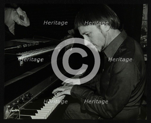 Michael Garrick playing the piano at The Bell, Codicote, Hertfordshire, 28 October 1980. Artist: Denis Williams