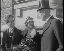 Crown Prince Leopold of Belgium and Princess Astrid of Sweden Walking With Her Parents..., 1926. Creator: British Pathe Ltd.