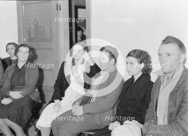 Night meeting in the FSA office, Tulare County, California, 1938. Creator: Dorothea Lange.