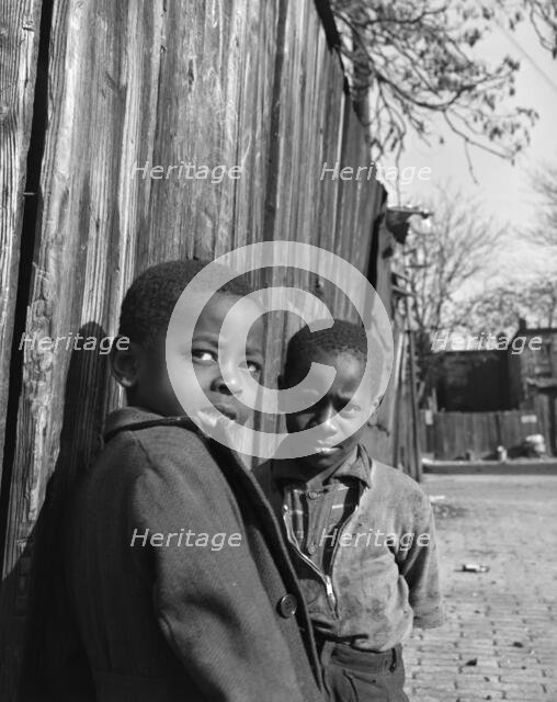 Two Negro boys, Washington (southwest section), D.C., 1942. Creator: Gordon Parks.