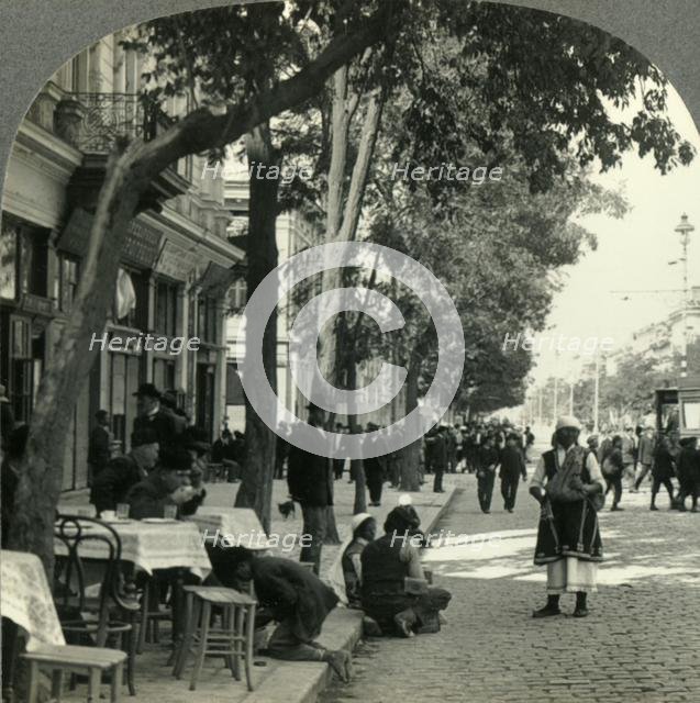 'Street Scene Showing Peasant Woman and Sidewalk Coffee-House, Sofia, Bulgaria', c1930s. Creator: Unknown.