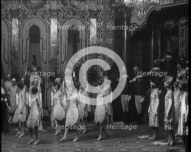 Scene from the Musical Princess Charming: a Group of Actors Dancing As the Actor Playing..., 1920s. Creator: British Pathe Ltd.