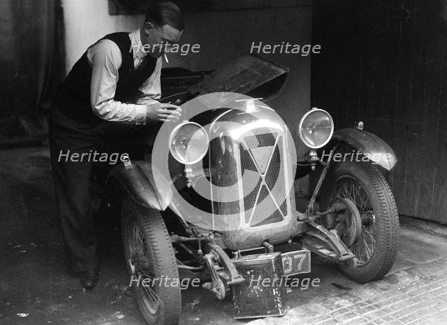 Geoffrey Baker working on a Salmson 1090cc car. Artist: Bill Brunell.