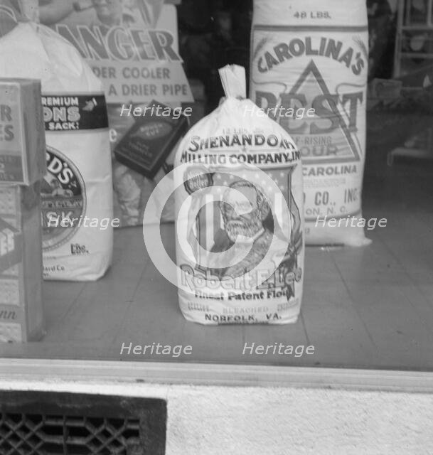A grocery window, 1939. Creator: Dorothea Lange.