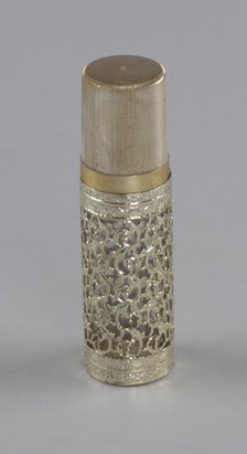 Gold and glass perfume bottle from Mae's Millinery Shop, 1941-1994. Creator: Anne Paree.