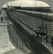 'Large Iron Ore Boat Coming into Sabin Locks. Sault Ste. Marie, Mich.', c1930s. Creator: Unknown.