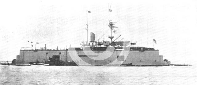 A battle-ship docked on the water: H.M.S. "Sans Pareil" on a floating-dock in the Tyne, 1909. Creator: L.N.A..