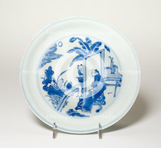 Plate with Scholar and Attendant in Garden, Qing dynasty (1644-1911), Kangxi period (1662-1722). Creator: Unknown.