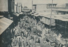 'Chaffering Oriental Crowds That Throng The Street Markets', c1935. Artist: Charles H Gabriel.
