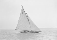 The 7 Metre yacht 'Ithnan' (K2) sailing close-hauled, 1911. Creator: Kirk & Sons of Cowes.