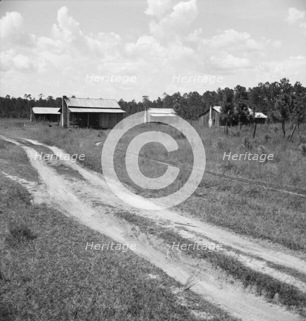 Turpentine worker's cabins, Valdosta, Georgia, 1937. Creator: Dorothea Lange.