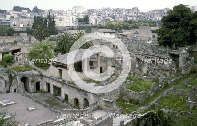 Buildings of Herculaneum with houses of the modern town of Ercolano above, Italy. Artist: Unknown