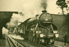 'A "Pacific" Engine Picking Up Water at the Rate of 2,500 Gallons in Ten Seconds - London and North  Creator: Unknown.