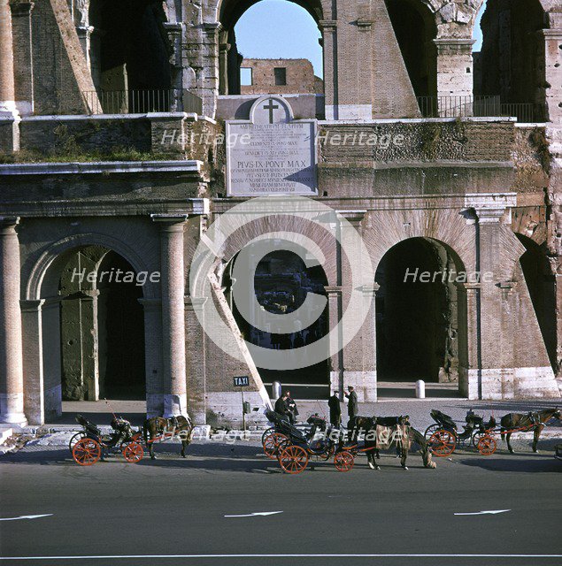 View of the Colosseum with cabs in front. Artist: Unknown