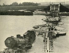 Bombed bridge and derailed train, northern France, First World War, 1914, (c1920). Creator: Unknown.