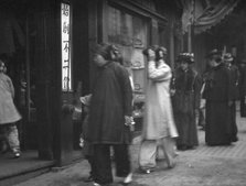 Chinese and American women walking down a street, Chinatown, San Francisco, between 1896 and 1906. Creator: Arnold Genthe.