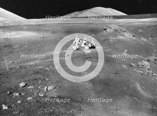 Lunarscape of Station 4, showing Harrison Schmitt at the lunar roving vehicle, 1972.  Creator: Unknown.