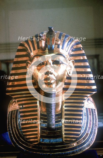Gold mask of Tutankhamun on his mummy-case. Artist: Unknown