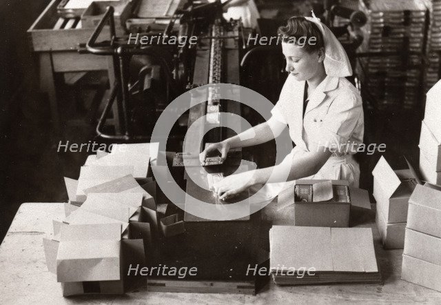 Woman packing Kit Kat into boxes, Rowntree factory, York, Yorkshire, 1949. Artist: Unknown