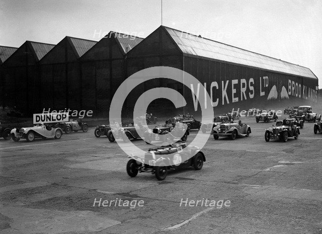 Cars racing at the MCC Members Meeting, Brooklands, 10 September 1938. Artist: Bill Brunell.