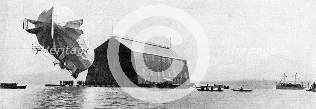 A Zeppelin entering its floating shed, c 1900, (c1920). Artist: Unknown
