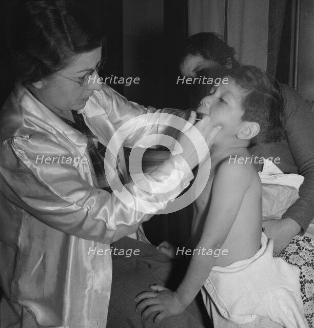 Visiting public health doctor conducts well-baby clinic..., Calipatria, Imperial Valley, 1939. Creator: Dorothea Lange.