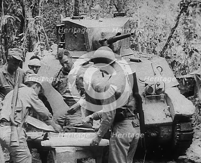 Commonwealth Troops Planning Next to a Tank, 1943. Creator: British Pathe Ltd.