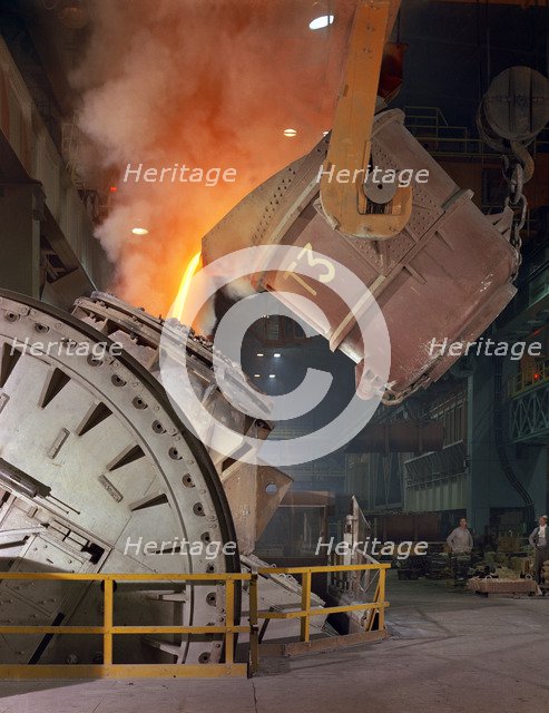 Pouring molten iron into a Kaldo unit, Park Gate Iron & Steel Co, Rotherham, South Yorkshire, 1964. Artist: Michael Walters