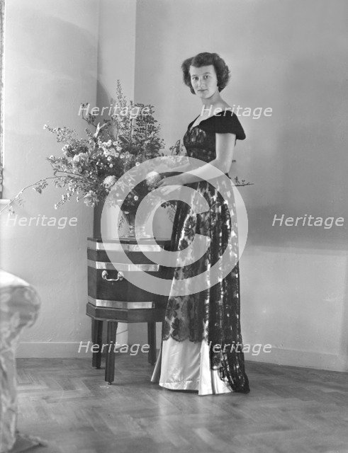 Portrait of woman in evening dress, (Isle of Wight?), c1935.  Creator: Kirk & Sons of Cowes.