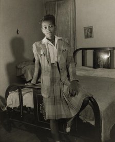 Adopted daughter of Mrs. Ella Watson, a government charwoman, Washington, D.C., 1942. Creator: Gordon Parks.