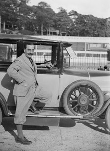 Hugh McConell beside a car, Brooklands, 3 August 1931. Artist: Bill Brunell.