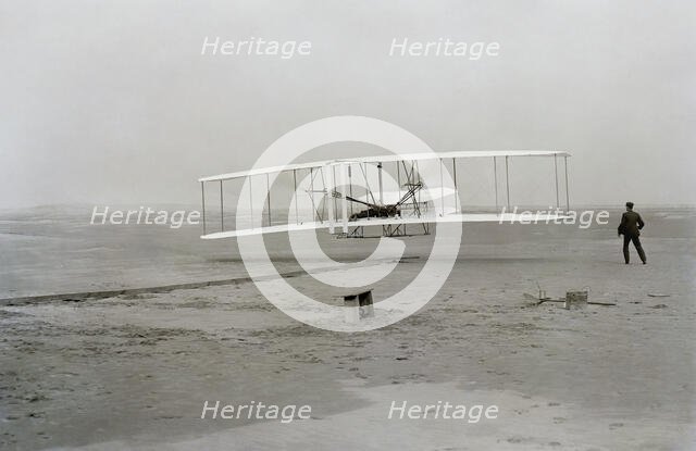 First flight of Wright brothers aircraft, Kitty Hawk, North Carolina, USA, December 17, 1903.  Creator: Unknown.