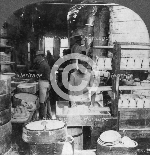 Firing tableware in the Noted Pottery Centre, Trenton, New Jersey, USA, early 20th century. Artist: Keystone View Company